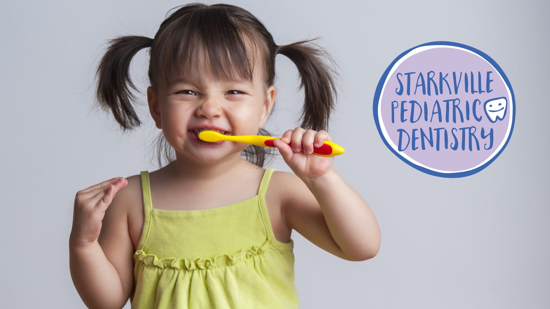 Cute little girl brushing teeth